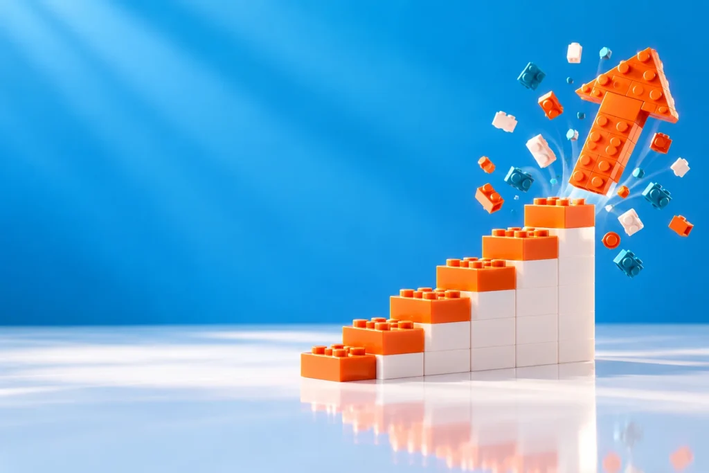 Brick staircase with an orange arrow launching upward, representing business growth